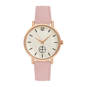 Close-up of minimalist rose gold quartz watch with pink leather strap and sand-texture dial