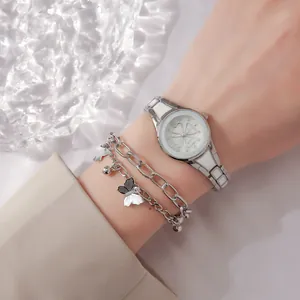 Elegant silver women's watch set with four-leaf clover dial and butterfly charm bracelet