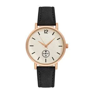 Detail of rose gold quartz watch featuring a matte dial and black pebble leather strap