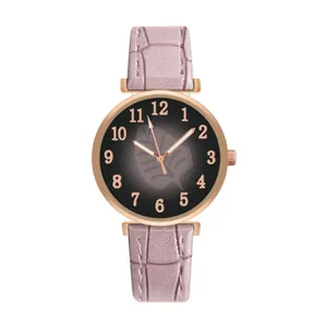 Detail of pink leaf pattern dial watch with rose gold case and leather strap texture