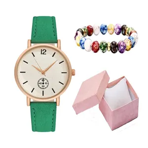 Minimalist women's quartz watch with green leather strap and matching beaded bracelet set