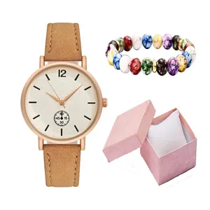 Minimalist quartz watch with brown leather strap and colorful beaded bracelet in a gift box