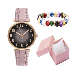 Pink faux leather watch with leaf pattern dial and beaded bracelet in a gift box set
