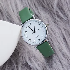 Minimalist women's quartz watch with white dial, green leather strap and silver case