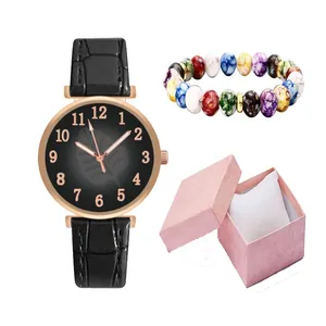 Women's quartz watch set with leaf pattern dial, beaded bracelet, and gift box