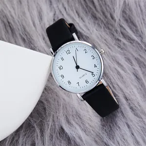 Minimalist women's quartz watch with black leather strap and white numeric dial