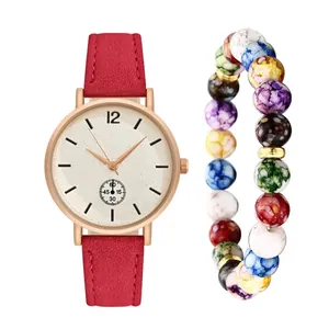 Women's quartz watch with red frosted leather strap and beaded bracelet set on white background
