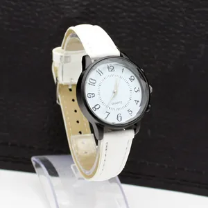 Detail of white wave pattern dial and black Arabic numerals on women quartz watch
