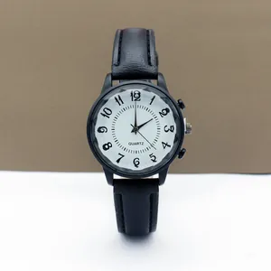 Close-up of retro quartz watch featuring white wave pattern dial and black Arabic numerals