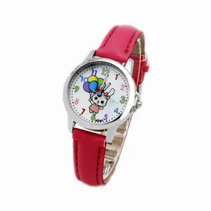 Detail of rose red strap and cartoon rabbit dial on a children's quartz wristwatch