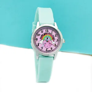 Detail of mint green silicone strap and cute rainbow pattern dial kids watch