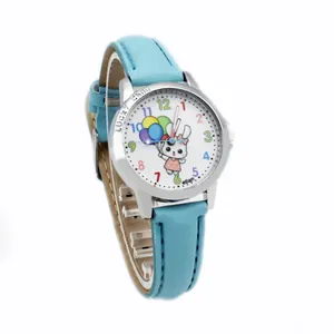 Detail of light blue quartz watch with a cute rabbit dial and colored numbers for kids