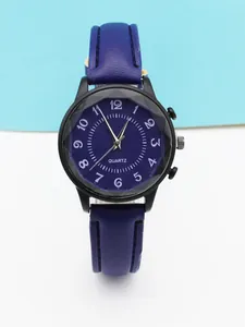 Detail of dark blue sunburst dial with white Arabic numerals and black quartz watch case