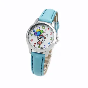 Detail of light blue leather strap and silver bezel with Lucky Child engraving on watch