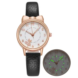 Detail of luminous watch hands and cute cat ear design on rose gold case