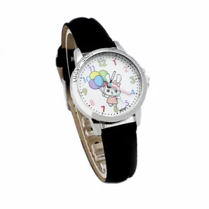 Close-up of kids quartz watch with cartoon rabbit dial and lucky child engraving