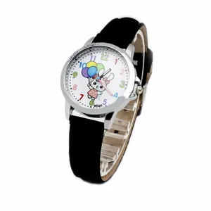 Detail of cartoon rabbit watch dial with colorful numbers and black leather strap