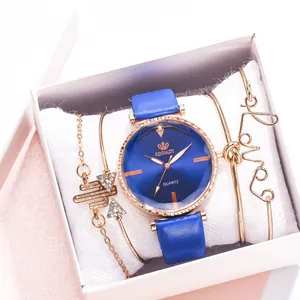 Coffret montre femme à quartz avec bracelet en cuir bleu et bracelets en or rose