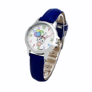 Detail of children watch with blue leather strap and colorful cartoon rabbit dial