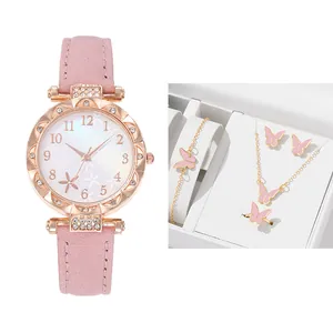 Pink leather watch with starfish floral dial and rhinestone case including matching jewelry set