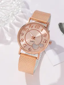 Montre quartz femme or rose avec cadran à motif cœur et bracelet élégant en maille