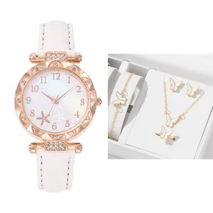 Detail of starfish dial watch and butterfly jewelry set in a white elegant gift box