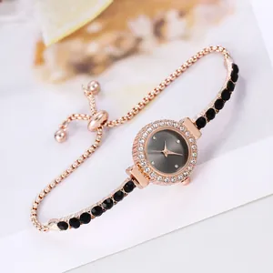 Detail of rose gold watch with rhinestone bezel and adjustable bolo sliding clasp