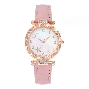 Detailed shot of women's rose gold quartz watch with rhinestone bezel and pink leather strap