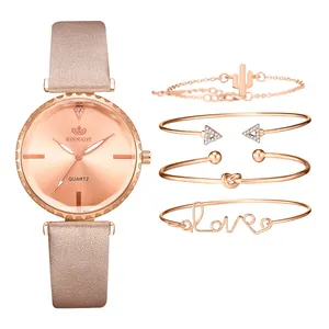 Montre à quartz or rose avec bracelet en cuir rose et quatre bracelets assortis