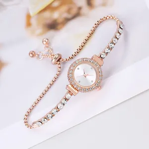 Detail of rose gold ladies watch with rhinestone bezel and adjustable slider chain