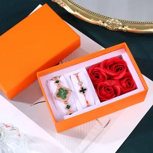Luxury rose gold clover watch and bracelet set with red flowers in orange gift box