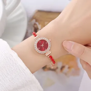 Women's quartz watch with red dial, rhinestone bezel and red bead bracelet strap