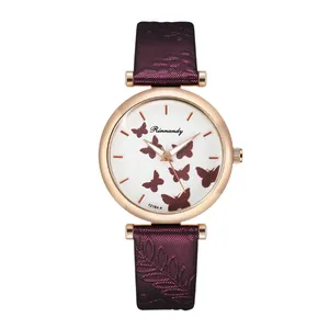 Close-up of Rinnandy quartz watch dial with butterfly pattern and embossed purple strap