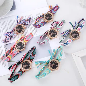 Flat lay of bohemian woven tassel watches with starry butterfly dials and rose gold cases
