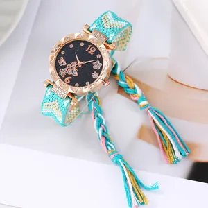 Ethnic style butterfly star dial watch with blue woven strap and rose gold rhinestone bezel
