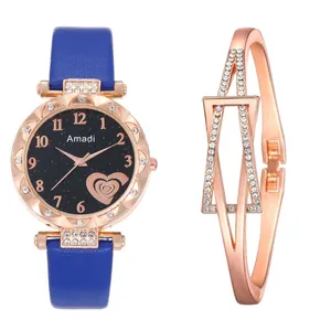 Detailed close-up of blue leather strap watch with rose gold crystal bezel and bracelet