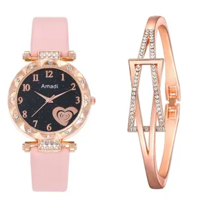 Detail of rose gold starry dial watch with heart motif and geometric diamond-set bracelet