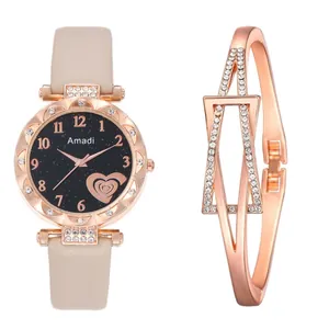 Macro detail of rose gold quartz watch with starry dial and matching open heart bracelet