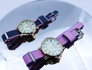 Detailed view of colorful NATO nylon straps and rose gold cases of quartz wristwatches