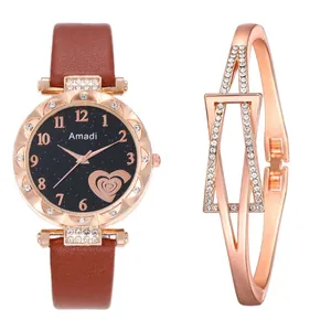Detail of rose gold quartz watch with starry dial paired with a rhinestone bracelet