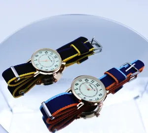 Close-up of dual quartz sports watches with colorful NATO nylon straps and rose gold cases