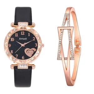 Close-up of black quartz watch with rose gold crystal bezel and matching metal bracelet