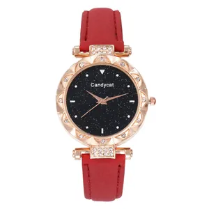 Detail of rose gold wavy bezel watch with sparkling crystals and starry sky dial