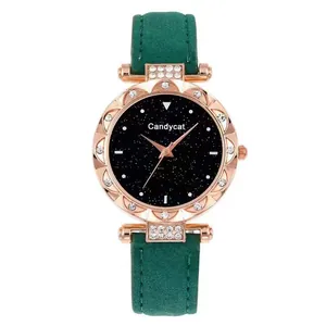 Detail of rose gold starry sky dial with rhinestones and green velvet watch strap