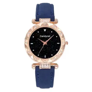 Macro detail of the starry black dial and rose gold rhinestone bezel on leather watch