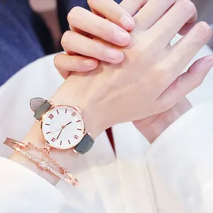 Orologio al quarzo da donna con cinturino grigio e set di bracciali con diamanti