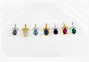 Detailed view of colorful teardrop silver pendants with cubic zirconia crown accents