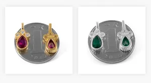 Macro detail of S925 sterling silver colorful teardrop pendants beside a coin for size