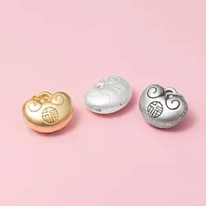 Three 3D S999 sterling silver Fu lock pendants in gold, matte silver, and vintage finishes