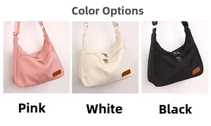 Nylon dumpling crossbody bags shown in pink, white, and black with double front zippers